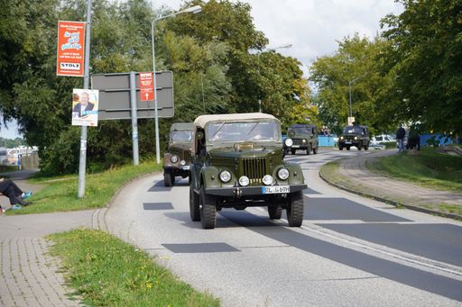 A large military truck driving through a road in Ribnitz Damgarten, Germany