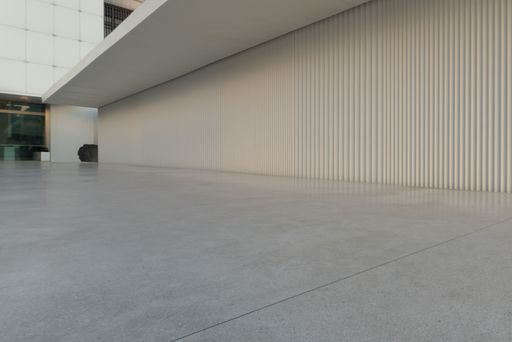 A shot of an empty marble ground on a high floor of a modern building with a copy space
