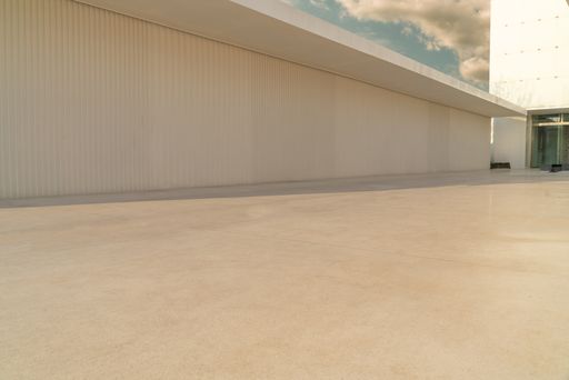 A shot of an empty marble ground on a high floor of a modern building with a copy space