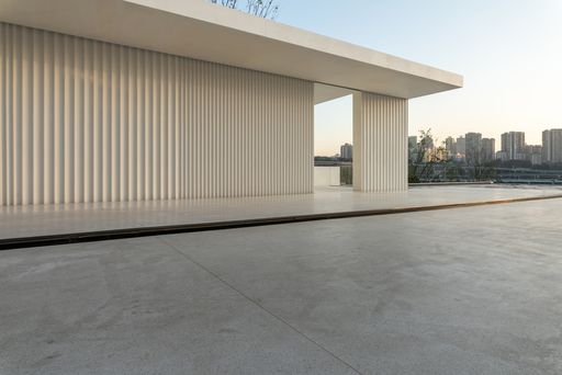 A shot of an empty marble ground on a high floor of a modern building with a copy space