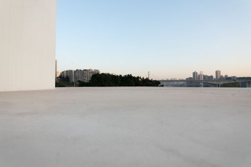 A shot of an empty marble ground and cityscape of a modern city