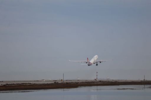 An Airbus A330 taking off from runway 01R at San Francisco international airport heading to Honolulu.