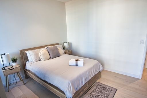 A beautiful shot of a bedroom in a residential house in Sydney, Australia, with a queen-sized bed
