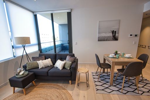 A modern apartment with combined lounge, kitchen and dining area, in Sydney, Australia