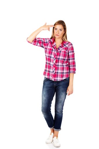 A vertical shot of Polish woman wearing flannel finger gun on her head isolated on white background