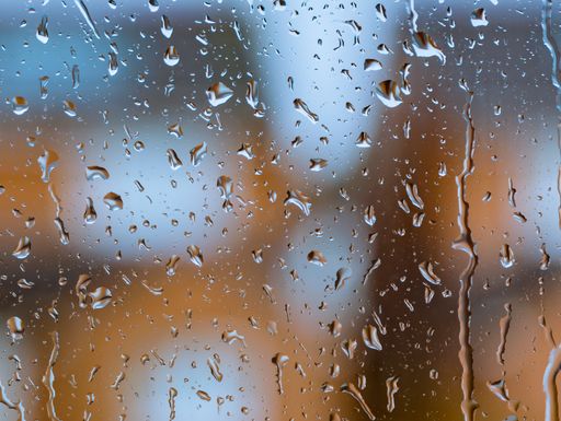 A closeup shot of a window covered in water droplets
