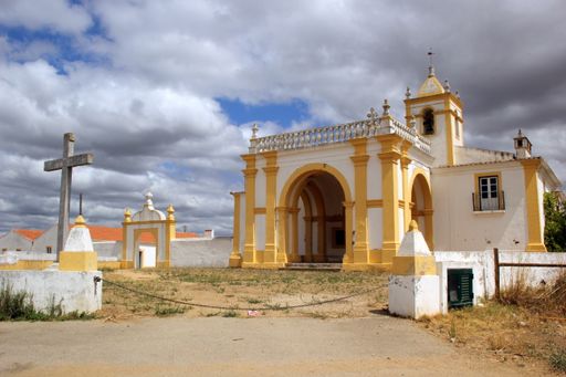 The beautiful Chapel of Nossa Senhora do Bom Sucesso in Portugal under a blue cloudy sky