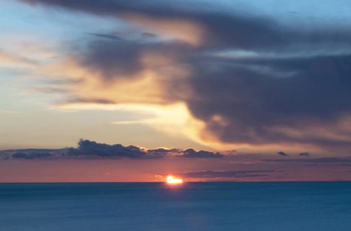 A wide angle shot of the Cadiz beach during a sunset in Spain