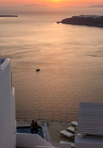 A vertical shot of the sunset over Santorini as seen from Imerovigli, Cyclades, Greece