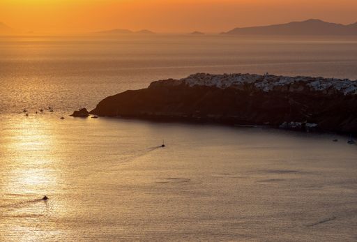A sunset over Santorini as seen from Imerovigli. Cyclades, Greece