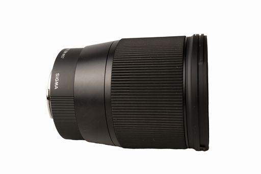 The Sigma 16mm F1.4 DC DN Contemporary lens is a wide-angle prime lens designed for mirrorless cameras, shown against a white background.