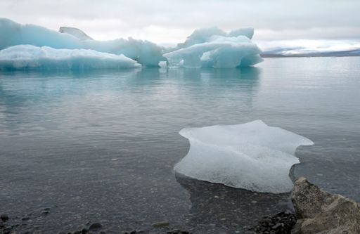 A chilly morning at Jokulsarlon Glacier Lagoon in Iceland with icebergs floating on the clear waters