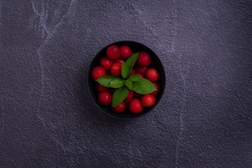 A delicious plate of fresh red plums from the field to enjoy
