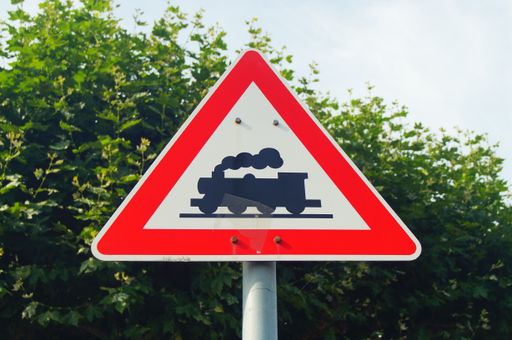 An old sign at a level crossing of the Frankfurt harbour railway. Since 1992, no steam locomotive has been used for sign no. 151. Museum track.