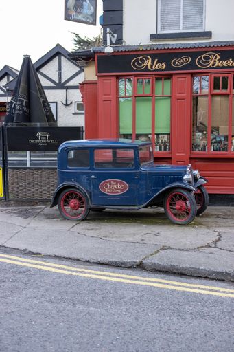 Dublin, Ireland, a street view of a closed pub and an old vintage car in front of it