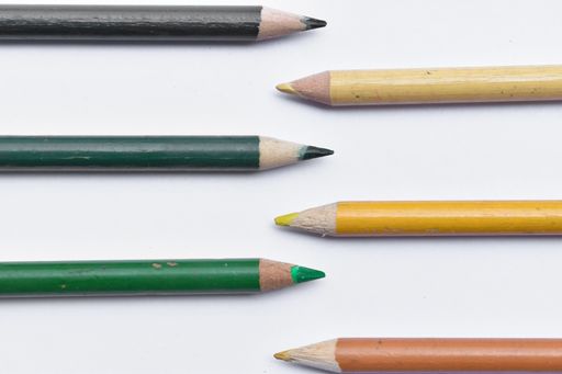 A top view of colorful pencils on a white surface