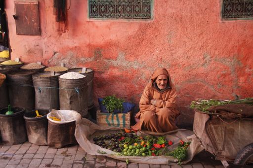 A merchant watching life go by
