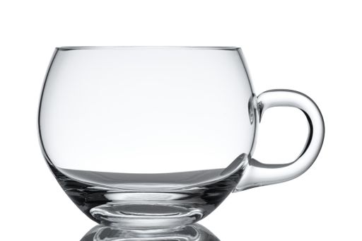 A closeup shot of an empty glass cup isolated on white
