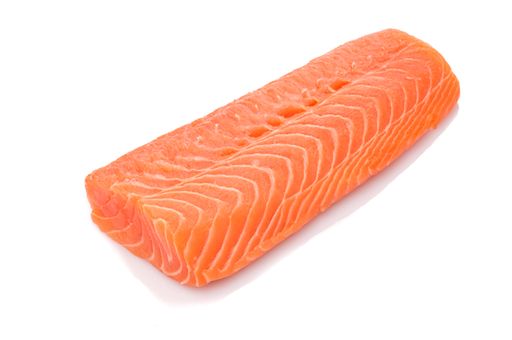 A closeup shot of raw orange salmon filet isolated on white