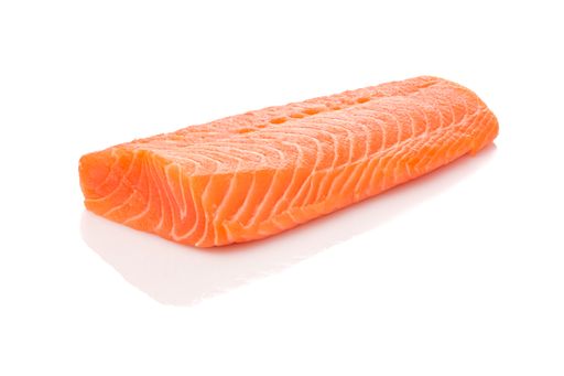 A closeup shot of raw orange salmon filet isolated on white
