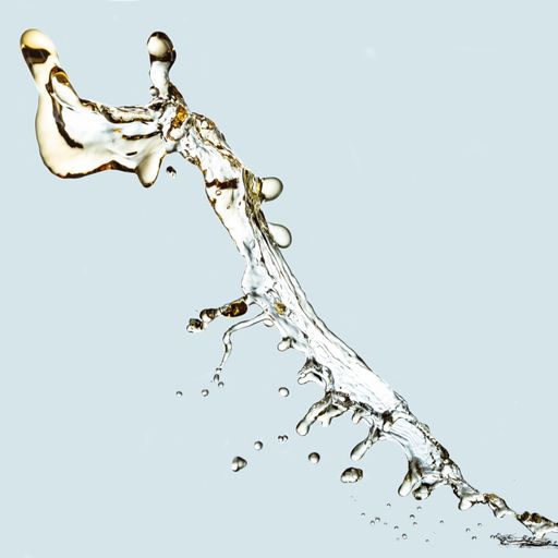 A splash of liquid on a light blue background