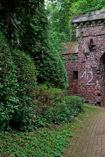 A historical brick gate in a park in Cologne, Germany