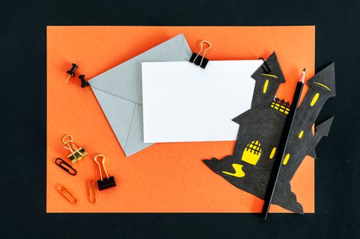 A closeup shot of an orange Halloween background with different Halloween decorations