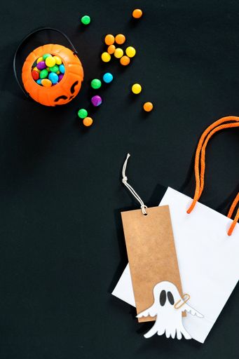 A vertical shot of a black Halloween background with copy space