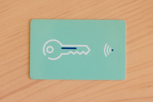 A top view of a hotel key card on a wooden table
