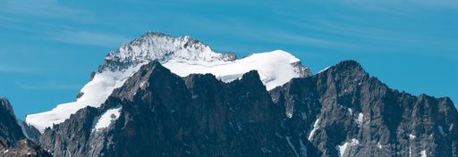 An aerial view of Summit of Barre des Ecrins covered with snow in Alps, France