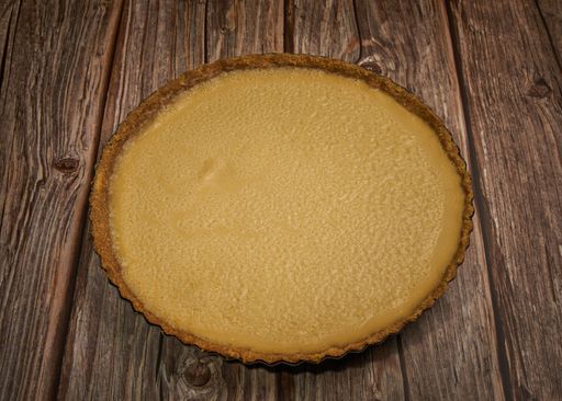 Cream cheese cake on a wooden surface