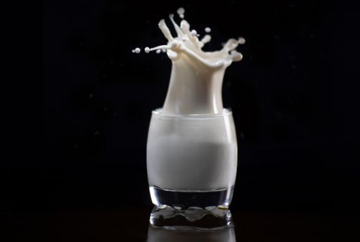Splash milk on the black background, splash
