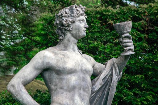 A sculpture of a Bacchus drinking from a goblet at Hardwick Hall, Derbyshire, England