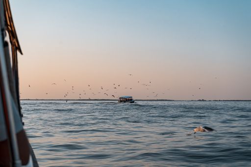 The sunset sky over the sea captured from a boat