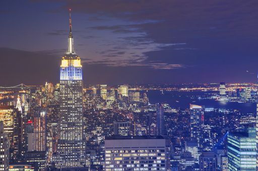 A beautiful aerial shot of The Empire State Building during nighttime in New York City