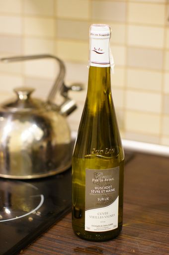 A closeup shot of a white wine glass bottle