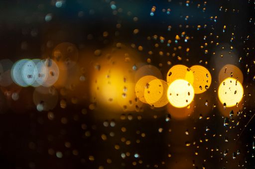 A closeup shot of the water drops on the glass surface