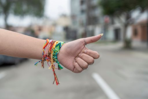 The colorful stylish bracelets on girl's hand