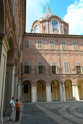 A vertical shot of the inner yard and Holy Shroud chapel near the famous historic Royal Palace of Turin