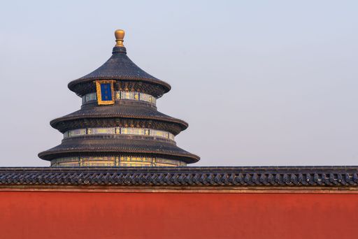 The Temple of Heaven in Beijing, China, features its iconic circular roof against a clear sky.