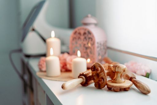 Aromatic candles and a set of wooden tools for massage