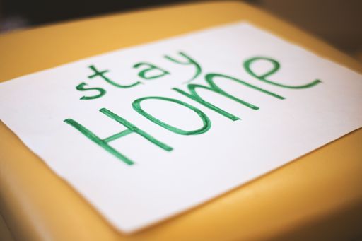 A white paper with stay home written on it