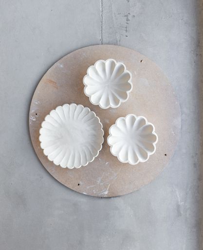 A selection of handmade stoneware ceramics in various glazes and decorations