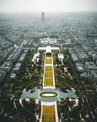 A vertical shot of a city view of Paris from the top of the Eiffel Tower, France