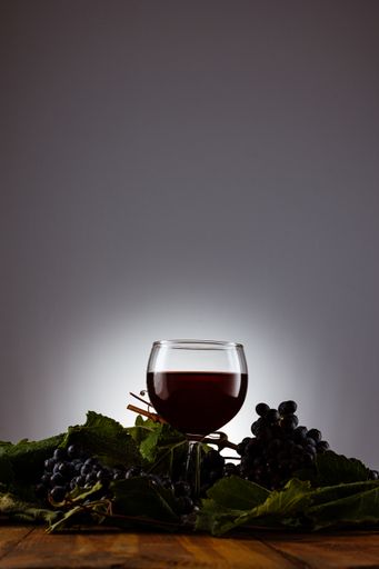 A vertical shot of a glass of red wine