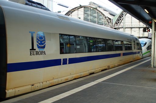 Head of an ICE 3, named "Europa", in European livery with blue stripe coupled with a classic one in Frankfurt Central station, Germany.