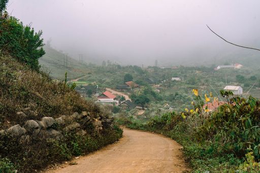 A closeup shot of a small path among hills going to the village