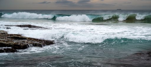 A shot of the Point Cartwright beach at the Sunshine Coast washed by big stormy waves in Queensland, Australia