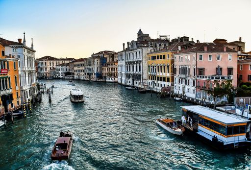 A high angle shot of the colorful buildings and houses around the river captured in Venice, Italy