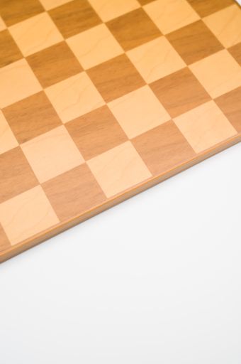 A vertical shot of a wooden chess board